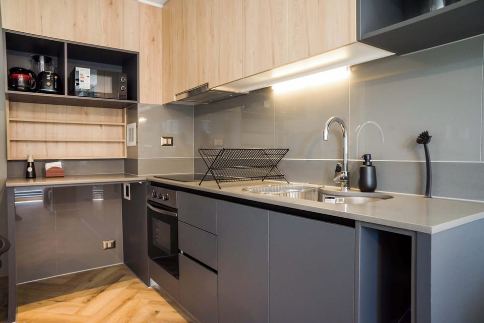 Stylish and fully-equipped kitchen with modern appliances, perfect for cooking your favorite meals.
