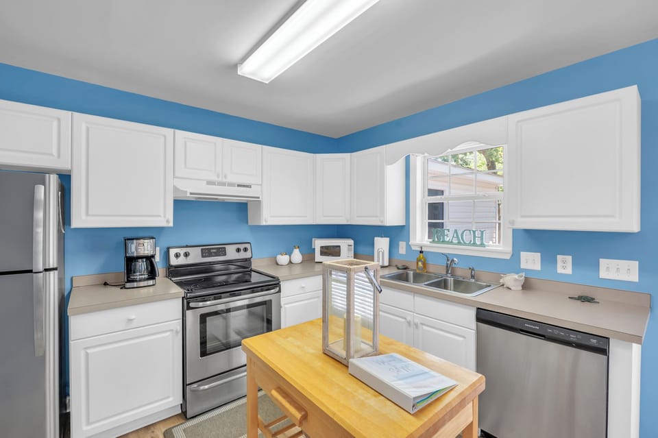 Well stocked kitchen with stainless appliances