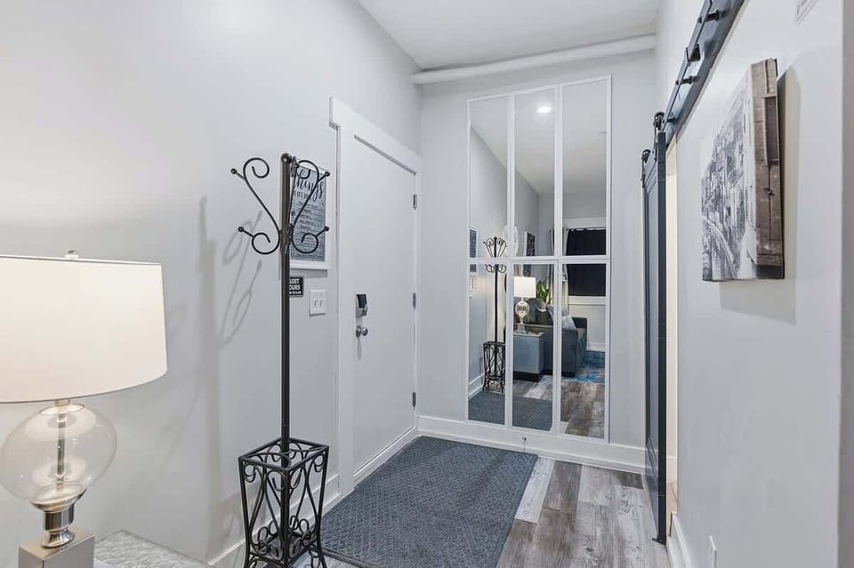 Entryway with coat rack and full-length mirror for added convenience