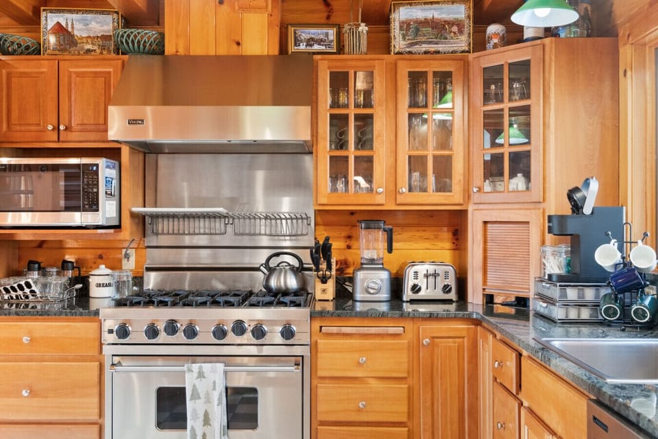 Cook together in a warm, wood-lined kitchen - fully stocked for winter comfort food