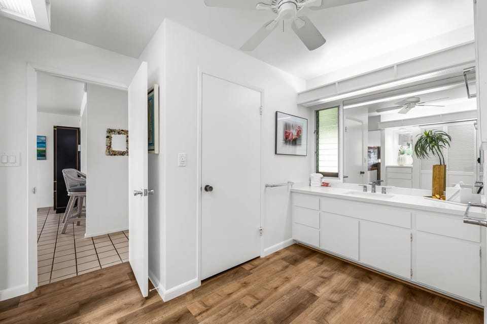 Convenient hallway vanity with generous counter space and storage adds functionality to the home's thoughtful layout