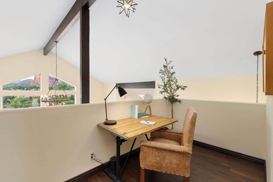 Bright loft workspace with scenic views and vaulted ceilings