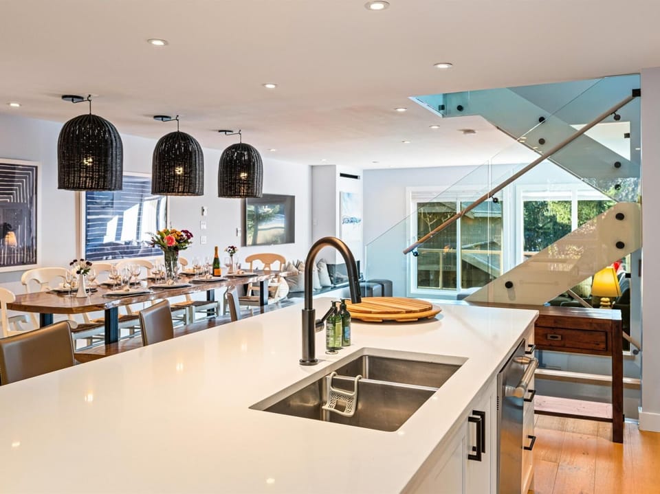 Bright and spacious kitchen with 4 seats at the island. Double oven, induction stove, dishwasher, drip coffee and fully stocked for entertaining.