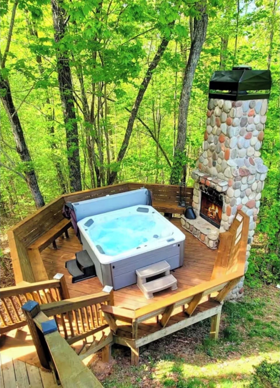 Enjoy a private hot tub with outdoor fireplace!