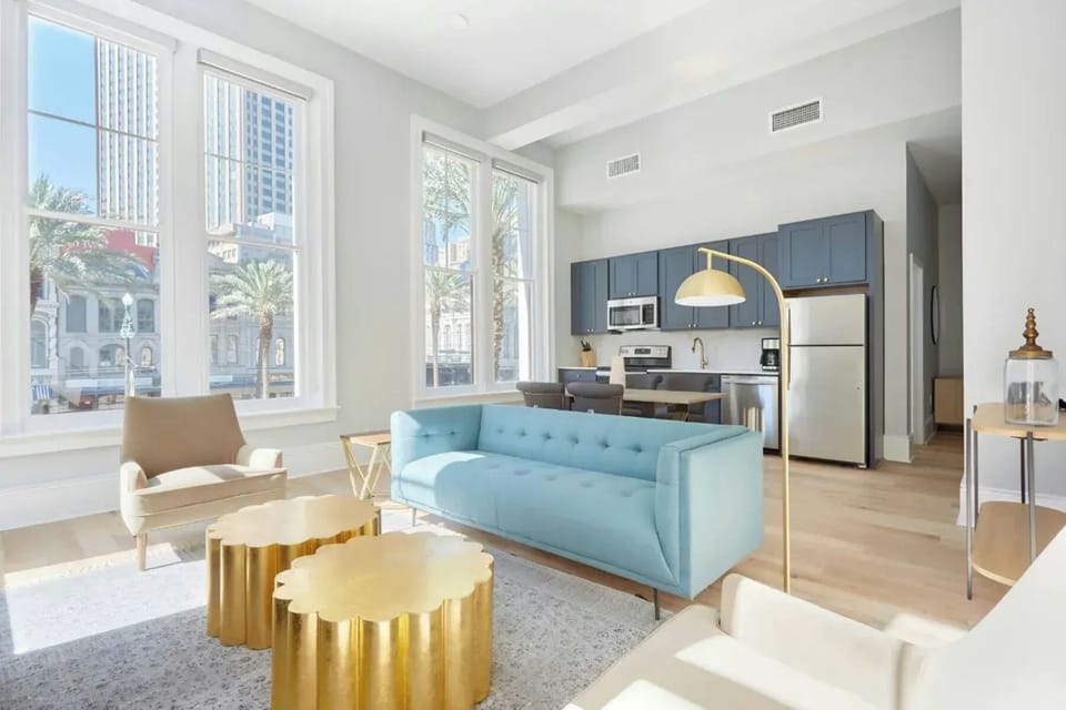 Bright and airy living room with plush seating and a TV to keep you entertained.