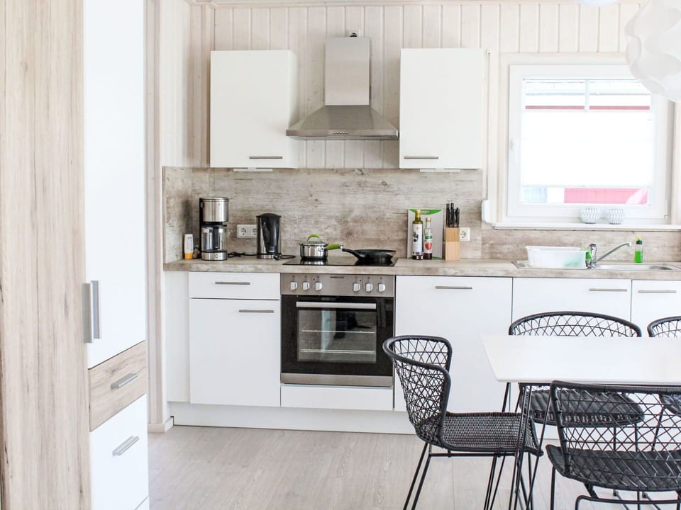 Furniture, Kitchen, Countertop, Kitchen Appliance, Interior Design, Cabinetry, Flooring, Wood, Major Appliance, Floor