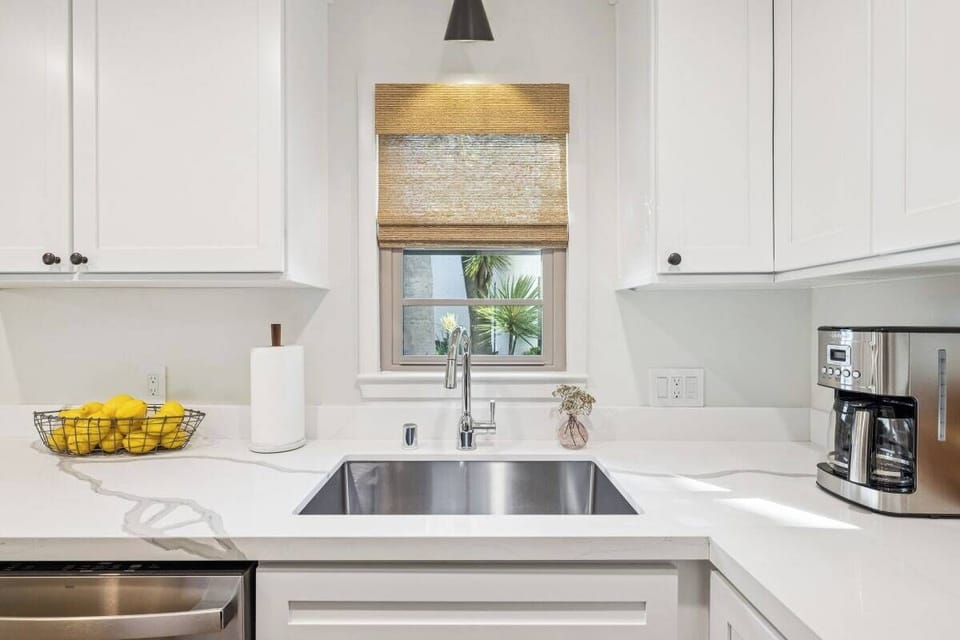 Full kitchen: Coffee drip, fridge, stove/oven, plates and utensils, dishwasher