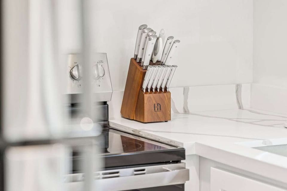 Full kitchen: Coffee drip, fridge, stove/oven, plates and utensils, dishwasher