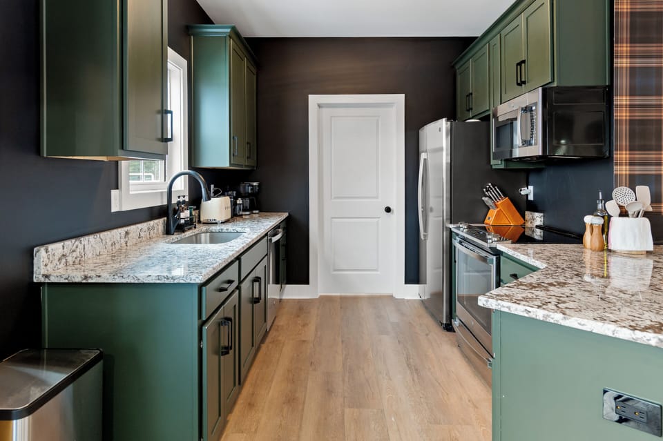 Galley-style gourmet kitchen with high-end appliances and ample prep space for group meals