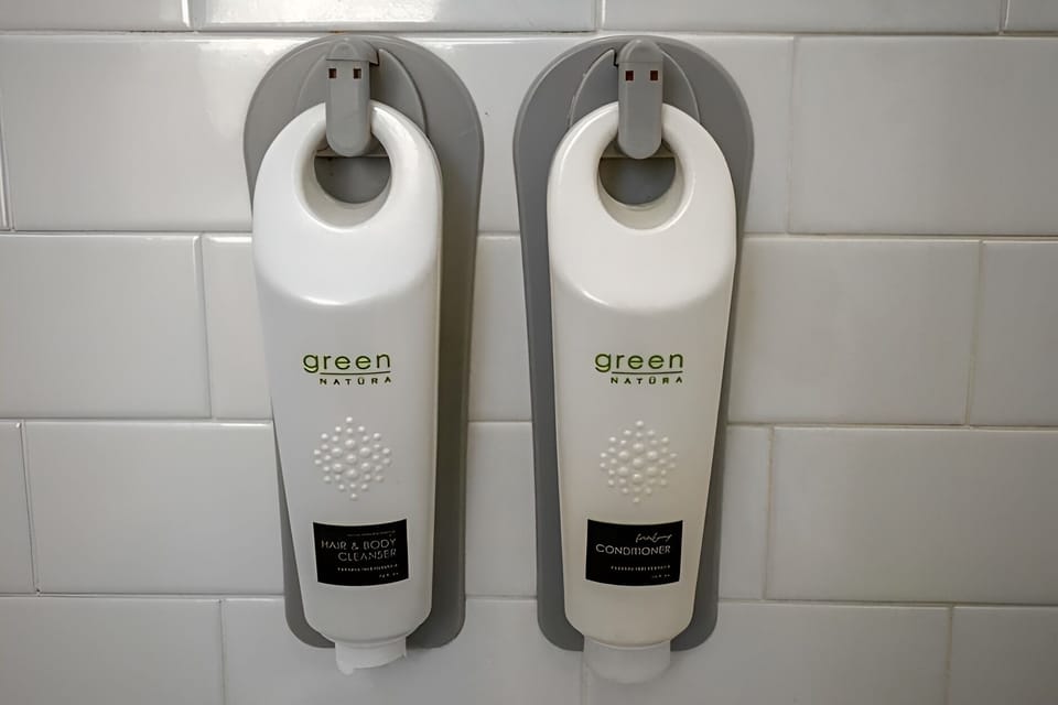Enjoy spa-like convenience with wall-mounted shampoo and conditioner.