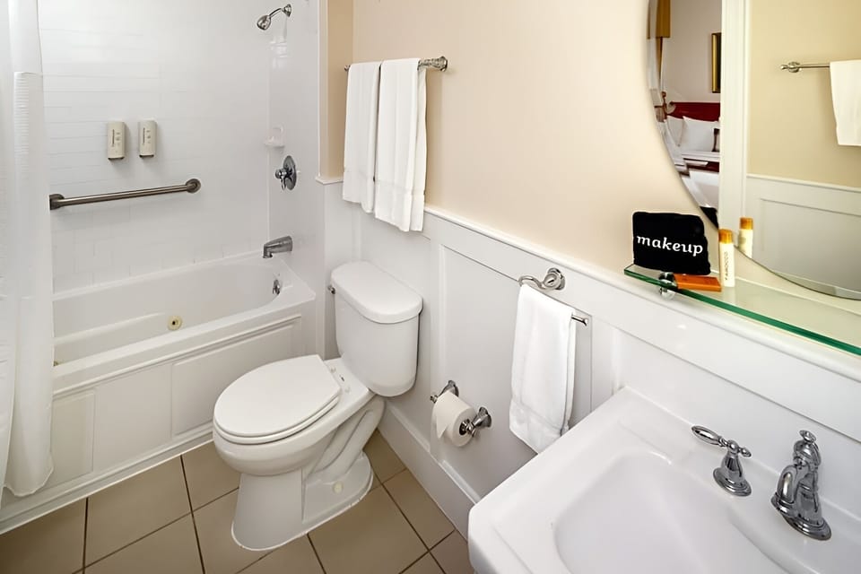 Refresh with a clean tub-shower combo and fluffy towels.