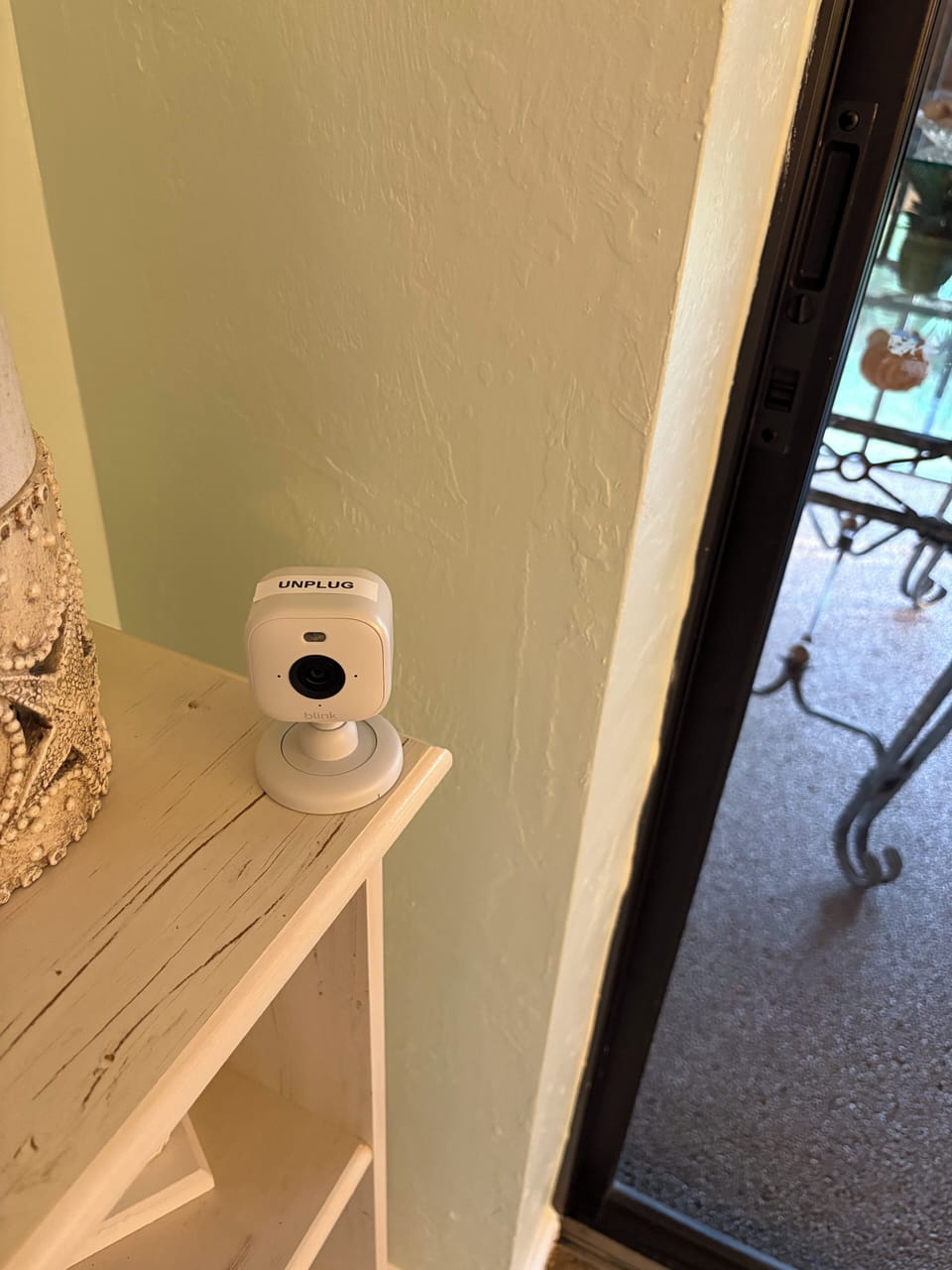 Camera 2 in Living room, facing front door. UNPLUG during arrival. 