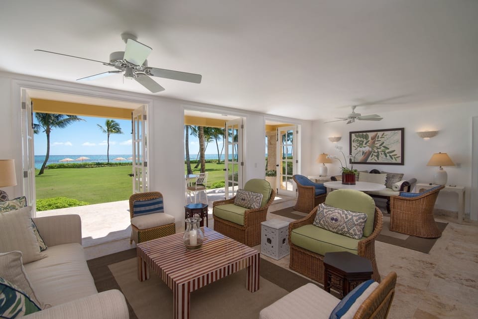 Unwind in airy seating while ocean breezes fill the room