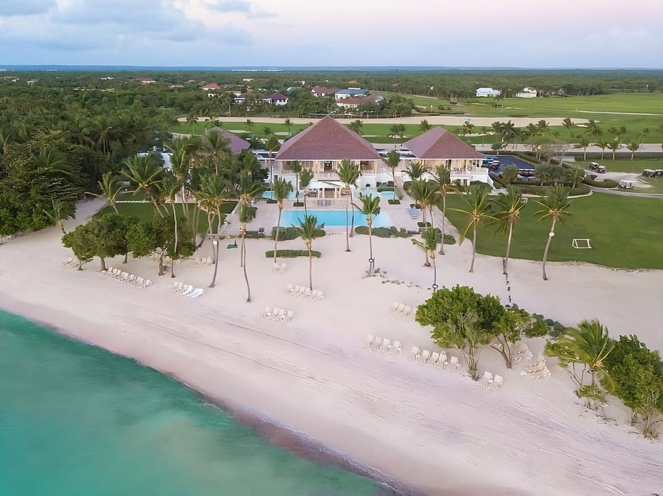 Escape to a breathtaking beachfront estate with turquoise waters.