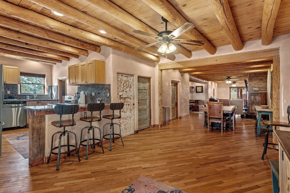 Open floorpan, traditional vigas, diamond plaster walls, custom doors, NMTrue.