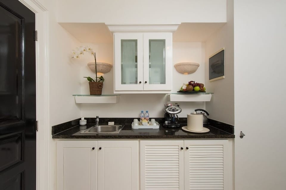Refresh drinks and snacks easily in your convenient kitchenette.