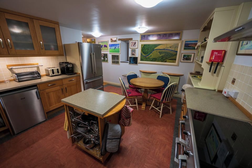 Substantial mobile island with pots and pans.