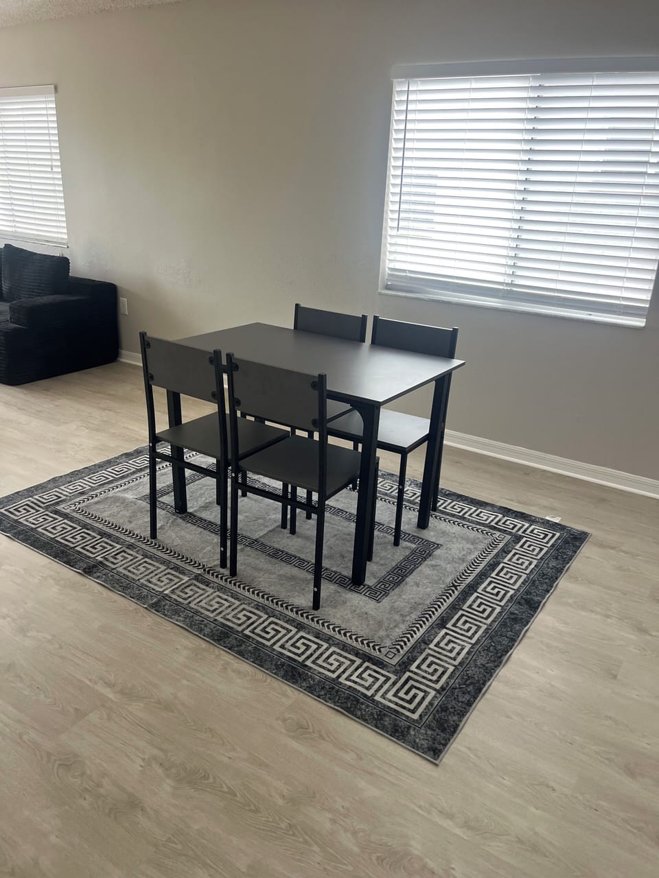 Modern dining area with table and seating, perfect for meals and gatherings.