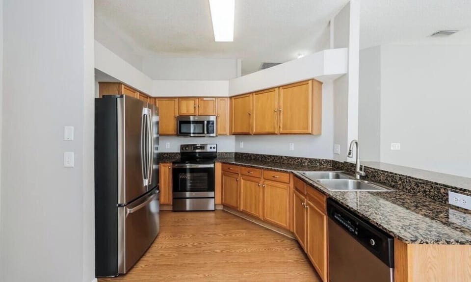 Fully equipped kitchen with all essentials for cooking and dining.
