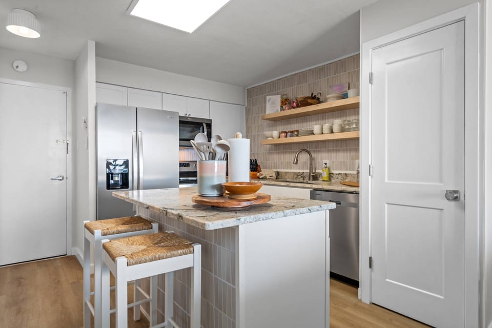 Kitchen island with seating offers a practical space for casual dining or morning coffee
