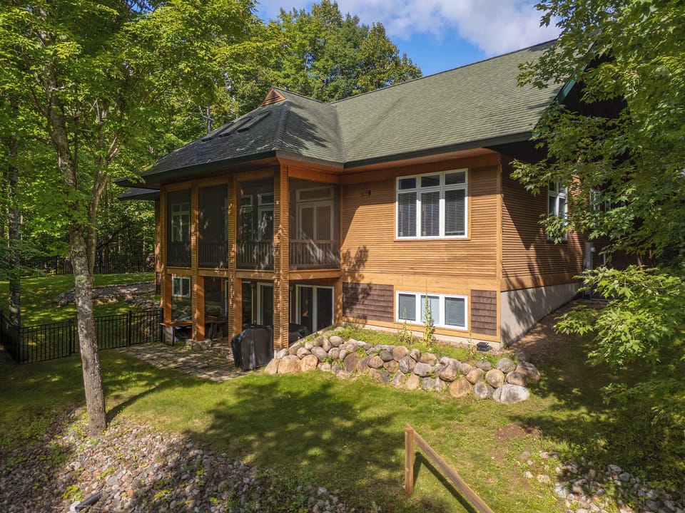 Welcome to Martha Lake Retreat – a peaceful lakefront escape surrounded by mature hardwoods on the shores of Little Martha Lake. This private waterfront home offers tranquility and natural beauty.