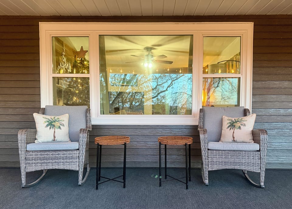 38-ft back porch with rockers, hammock, rope lights, carpeted floor, smoke-free