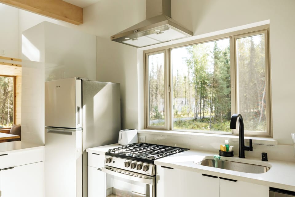 Enjoy natural sunlight and outdoor views while cooking