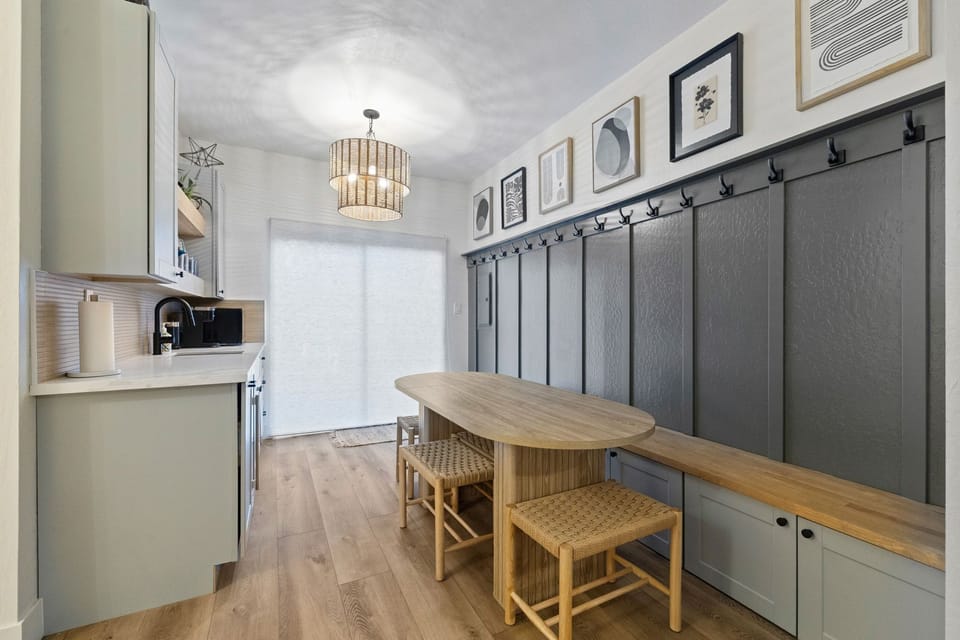 Kitchenette with dining, games, wall hooks and a slider to access the front of the house.