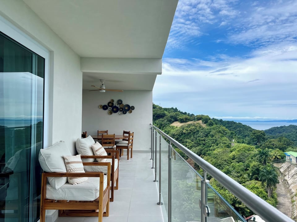 Balcony with custom teak furniture and seating
