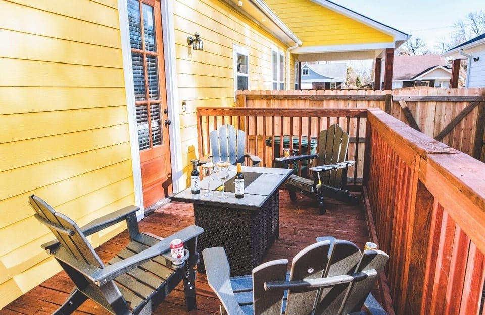 Cozy patio with Adirondack chairs and convenient cup holders.