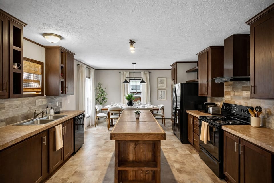 Open layout connecting the kitchen to the dining area for easy meals together.
