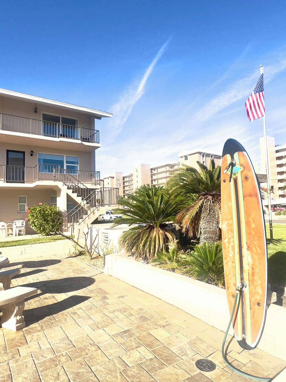 Outdoor surfboard shower. Condo unit pictured (stairs required)