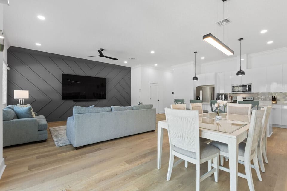 View of dining area, living room, and kitchen