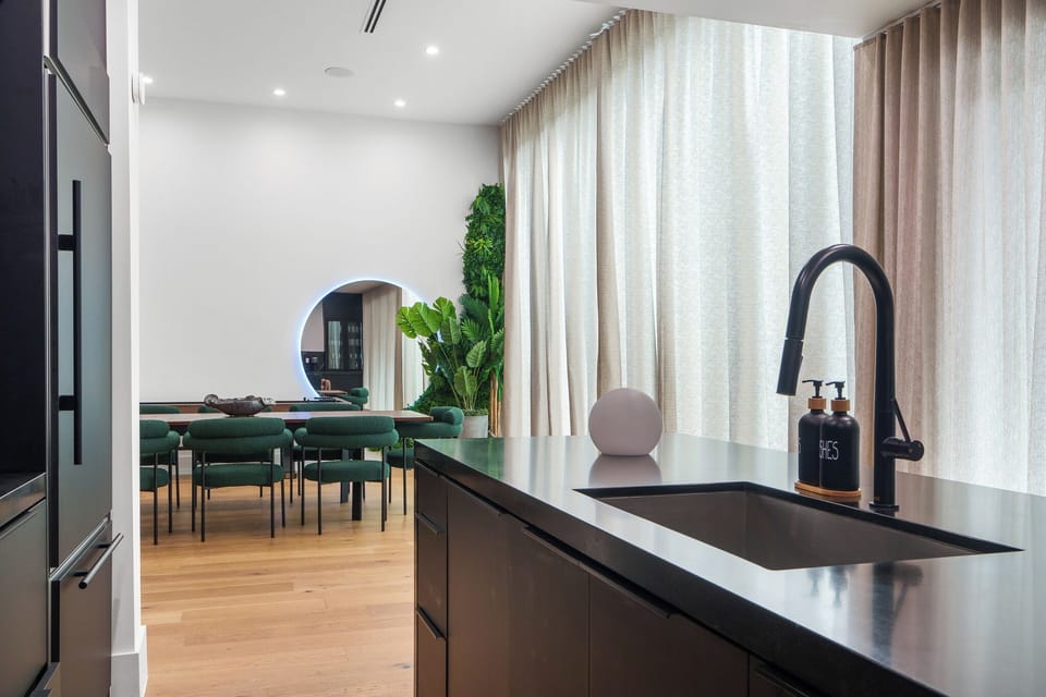 Sleek kitchen island with modern faucet and clean design