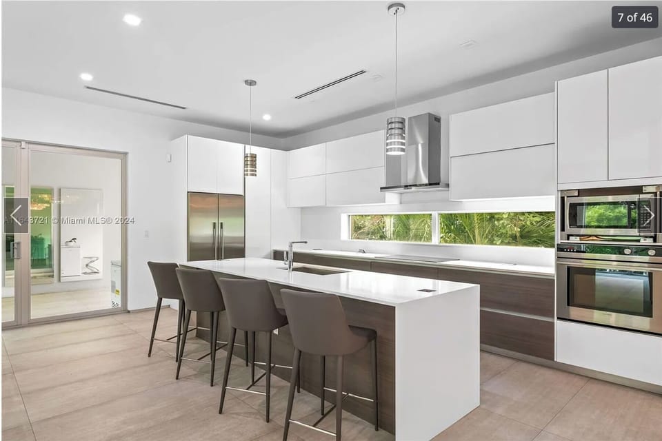 Large kitchen island with bar seating and modern finishes