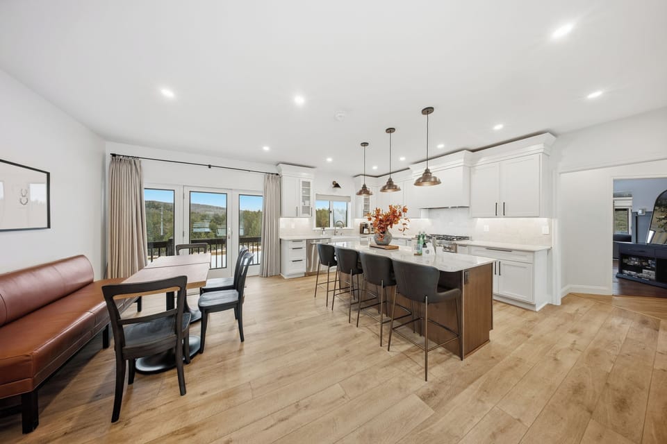 Kitchen island and dining area seat up to 17 guests