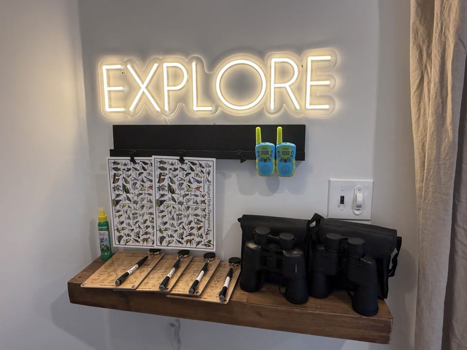 Explore station with walkie-talkies, binoculars & nature scavenger hunts