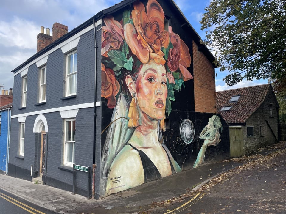 Entry to the ground floor apartment is through the front of the old Globe pub. First floor entry is through the grey gate next to the mural.