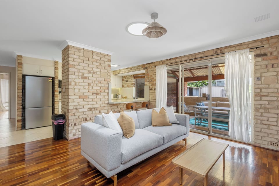 Living space with comfortable couch close to the kitchen. 