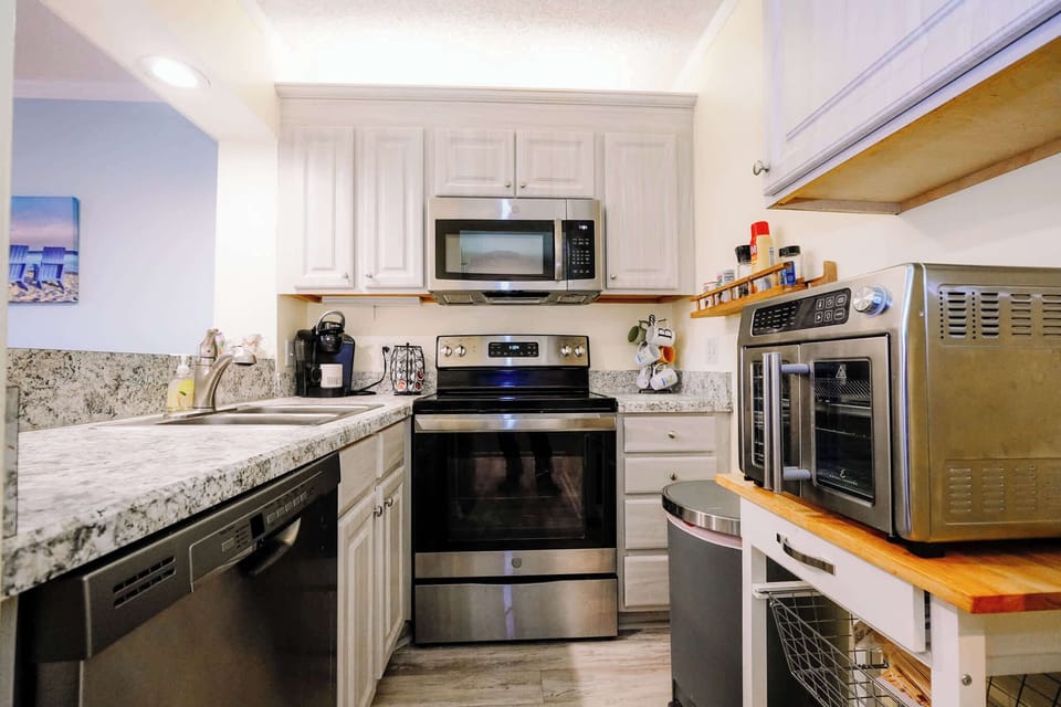 Full kitchen stocked with dishes, cookware, and essentials plus a Keurig for easy mornings with your favorite coffee