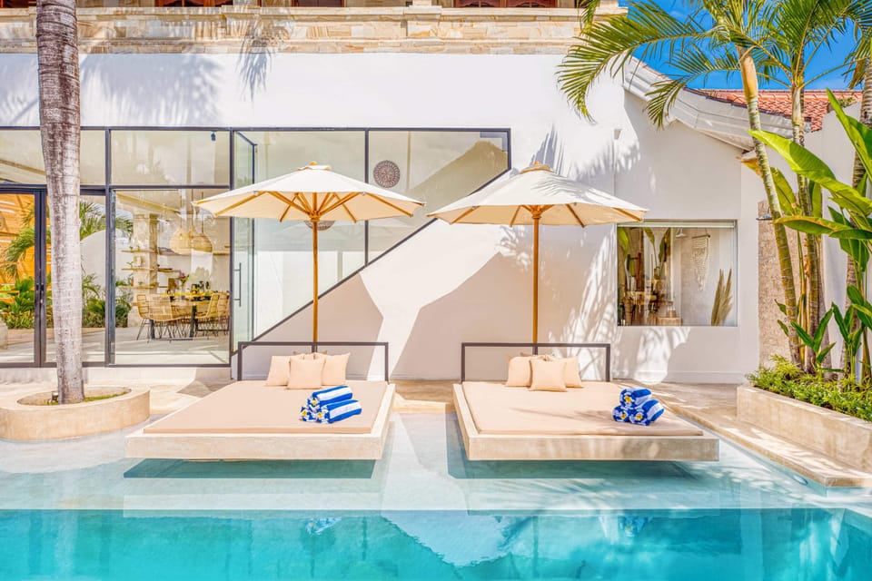 Comfy sunbeds built into the pool