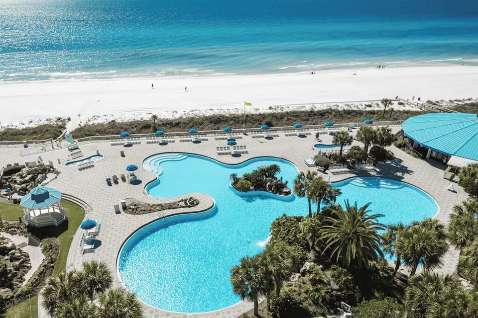 Large Pool, Hot Tubs and Beach Access across the Pedestrian Bridge