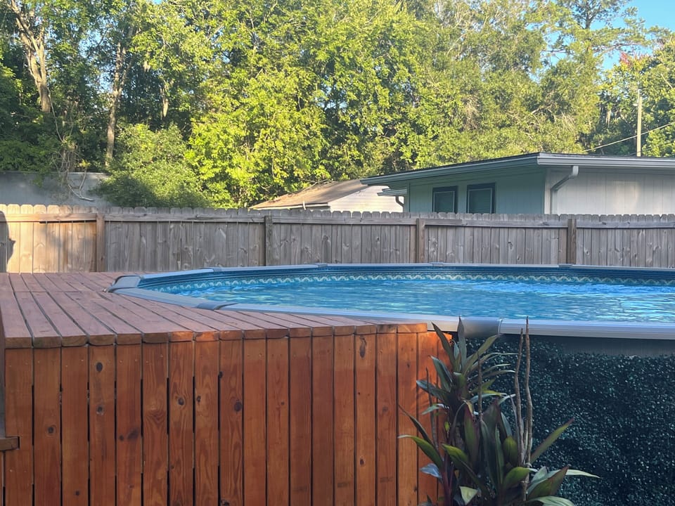 Outdoor Pool in Backyard with Deck