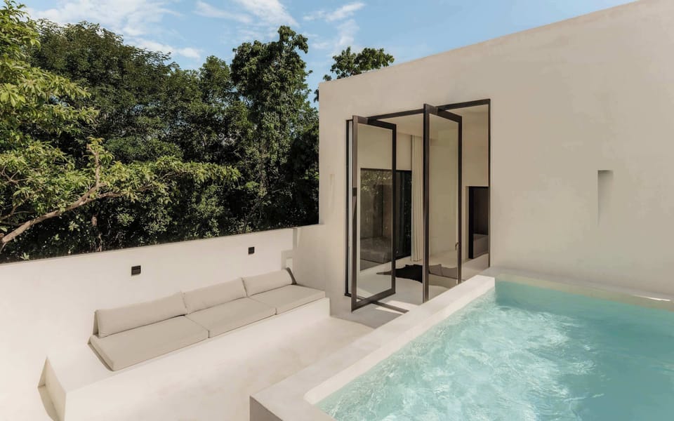 Rooftop plunge pool terrace with open-sky views.