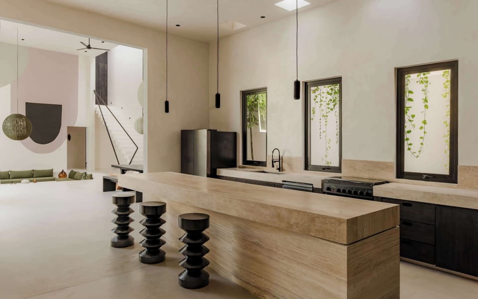 Fully equipped kitchen with premium appliances and stone finishes.