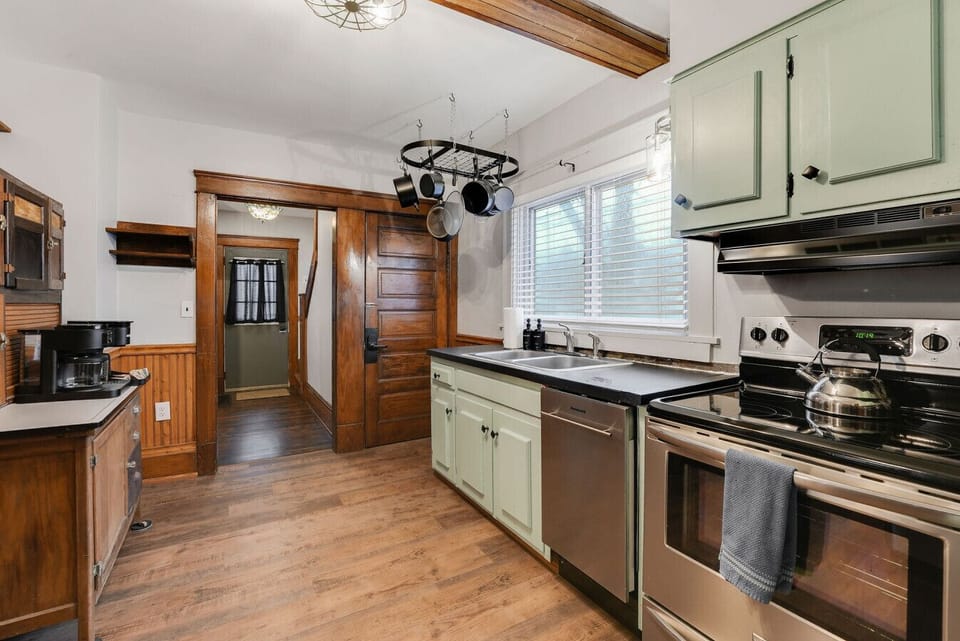 Classic kitchen with vintage character and modern functionality, perfect for preparing meals after exploring Ashtabula Harbor. Full bathroom located just off the kitchen.