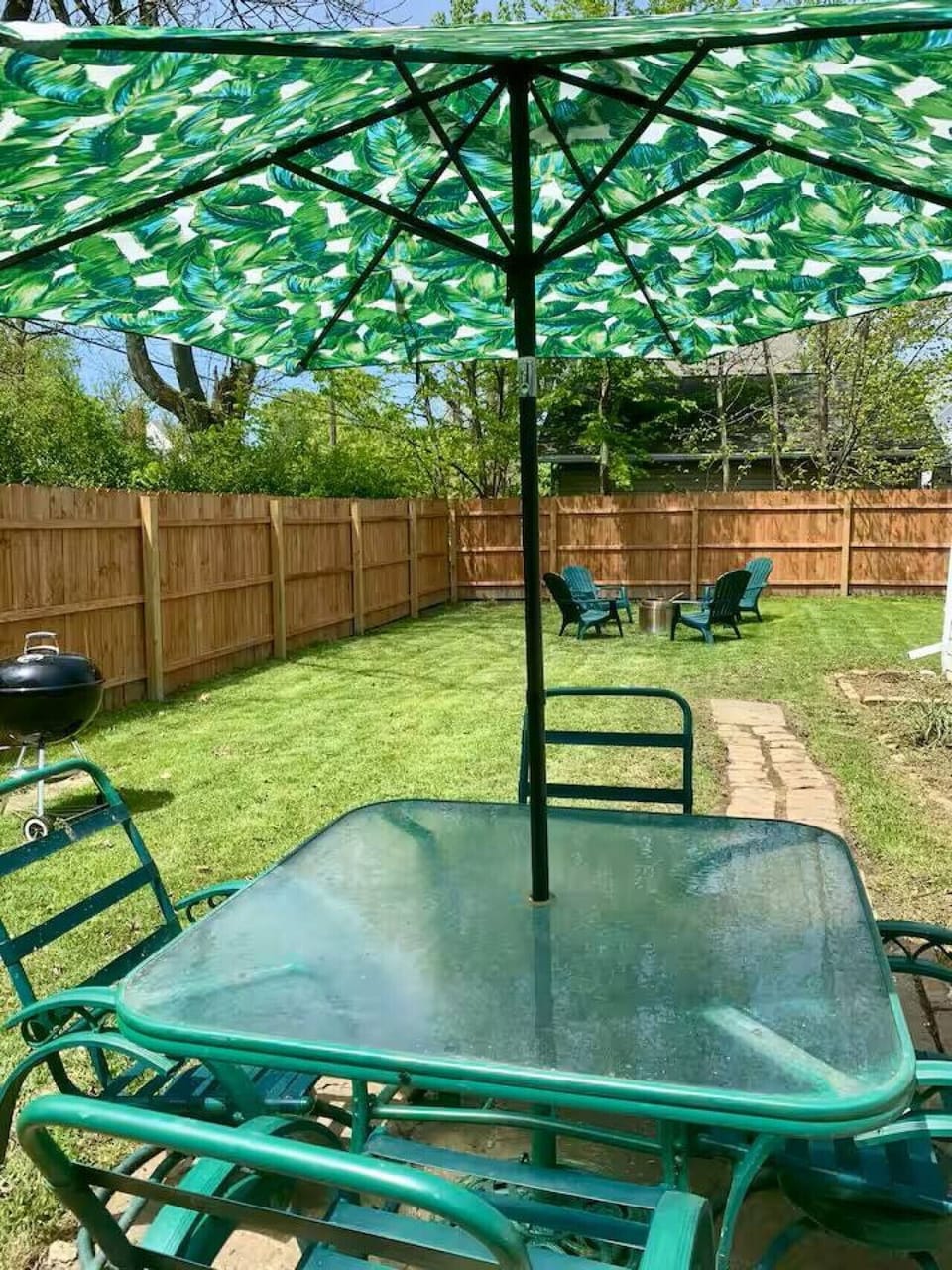 Spacious backyard retreat with seating and fire pit—great for relaxing after a day at the harbor.