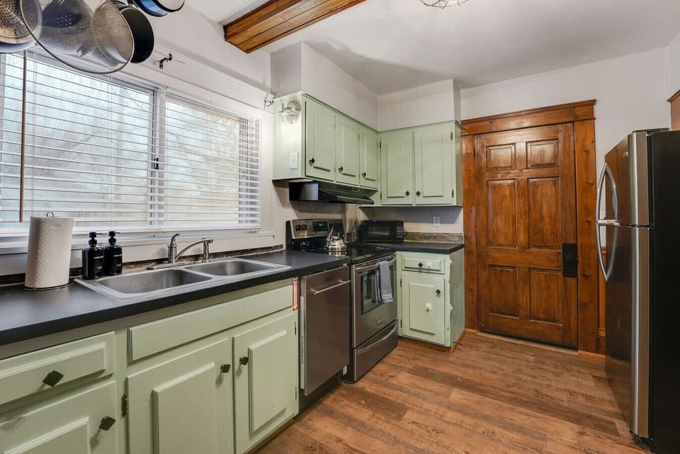 Light filled kitchen with vintage charm, perfect for morning coffee before exploring Ashtabula Harbor.