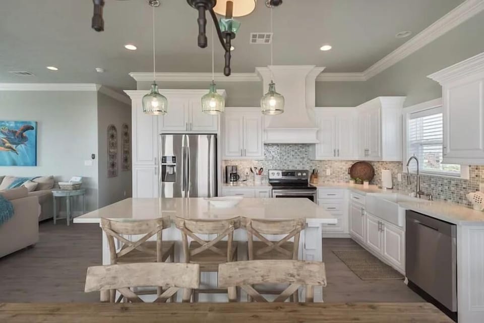 This kitchen invites you to create lasting memories with a large island perfect for prepping, casual dining, or catching up with loved ones.