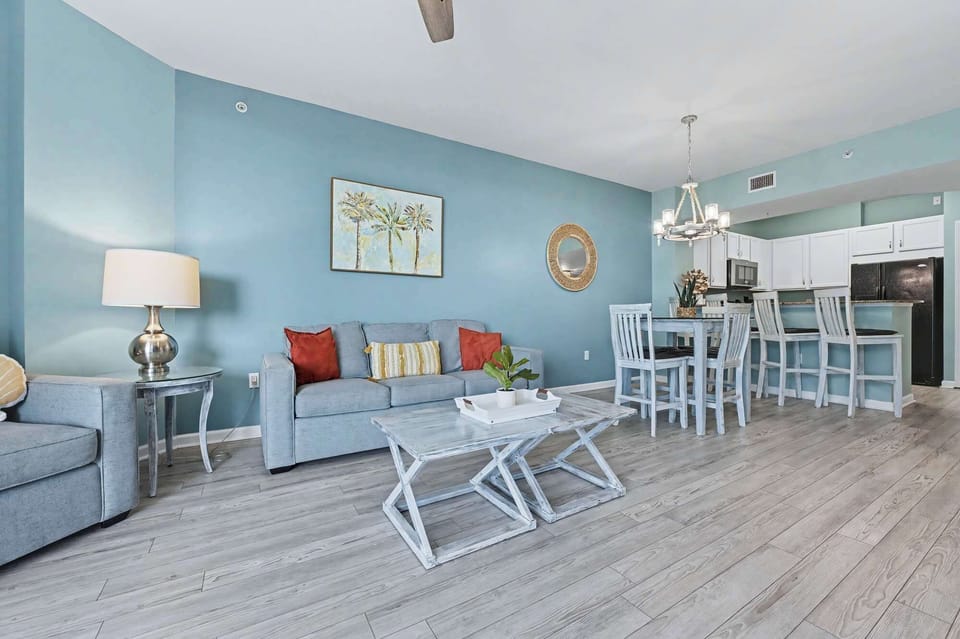 Bright living area with sofa sleeper, and Smart TV